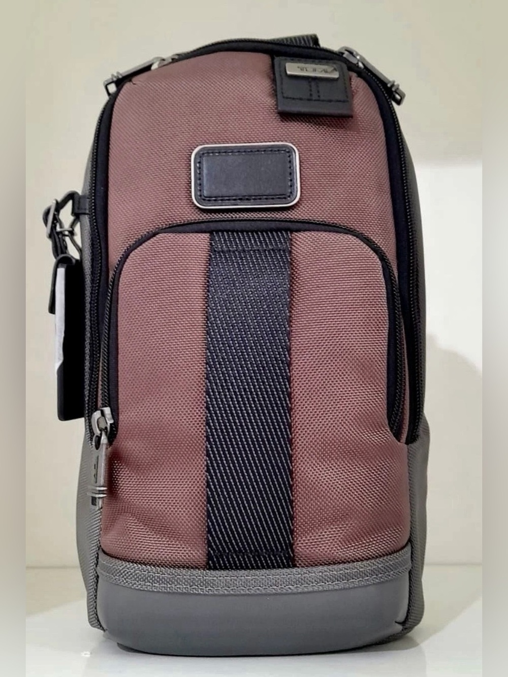 NWT Tumi FIFE Slim Sling Bag Copper and Black